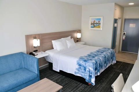 Settle into a bright king room with cozy lounge seating.