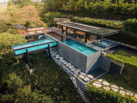 Arrive to a breathtaking hilltop pool and hot tub retreat