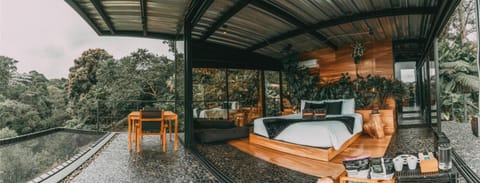 Wake up in a serene bed surrounded by panoramic greenery.