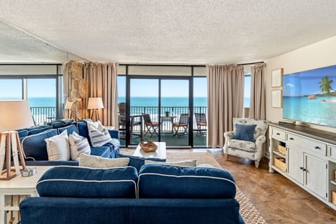 Welcome to this coastal, cozy condo right on the beach with breathtaking views right from the living room!