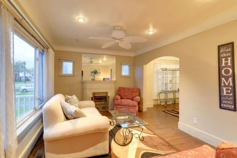 Living Room | Fireplace Mantel | Large Windows Ceiling Fan