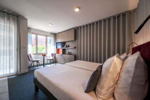 Comfortable double bed in a contemporary studio designed for couples or two guests.