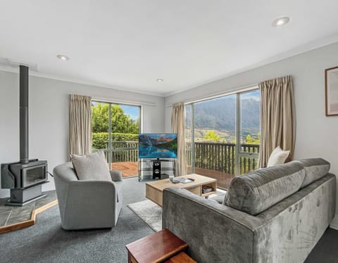 Bright living area with lake and mountain views