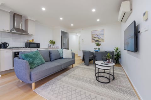 Bright modern living with AC, full kitchen, dining nook & stylish decor