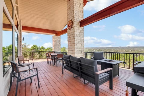 Relax on your private deck with panoramic views, comfortable seating, and dining space overlooking rolling hills and endless skies.