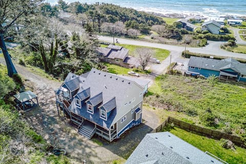 Coastal retreat nestled between forest and ocean, offering peaceful seclusion with easy beach access in a charming seaside community.