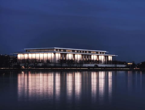 Unwind by shimmering waterfront views under a glowing evening sky.
