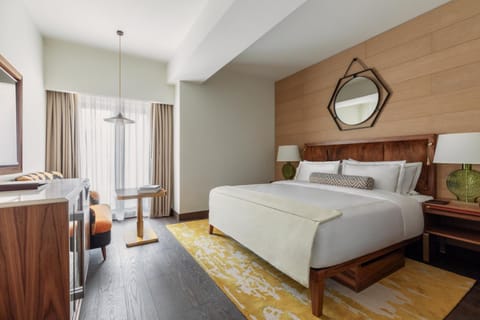 Stretch out in a serene king bed with cozy seating.