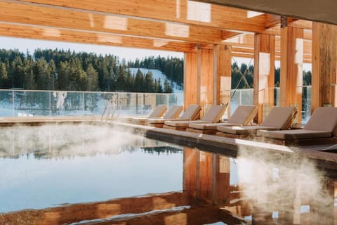 Breathe in alpine air while steam rises from the pool.