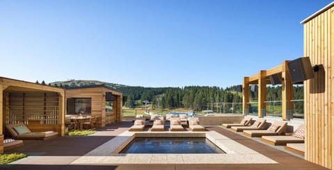 Stretch out on rooftop loungers and savor the wide-open views.
