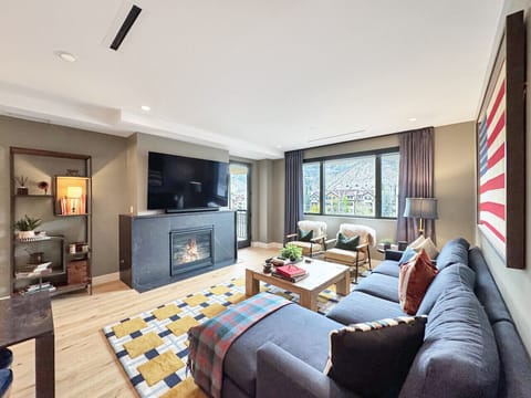 Natural light pours into this elegant living space, gas fireplace glowing, 75` smart TV ready, oversized seating for the whole group. Curl up with a book or toast to the Rockies
