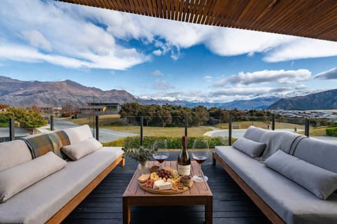 Enjoy sitting on the deck with stunning views and a local red