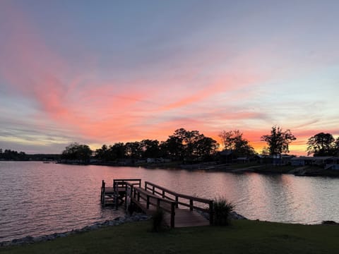 Sunset lakefront with private dock—serene views and easy water access.