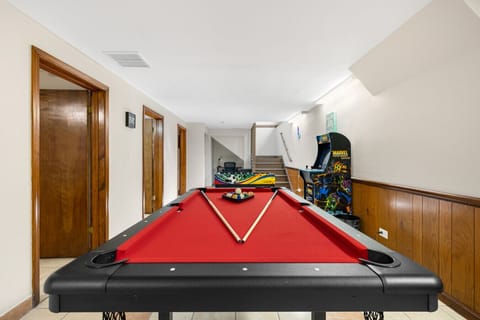Game on! 🎱 Enjoy a dedicated game room with a pool table and comfy seating—perfect for relaxing, competing, and having fun.