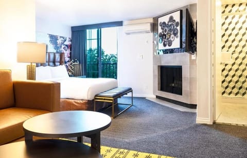 Stretch out in a spacious suite with cozy fireplace ambiance.