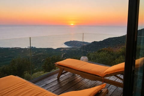 Sunset sea view from the terrace with loungers.