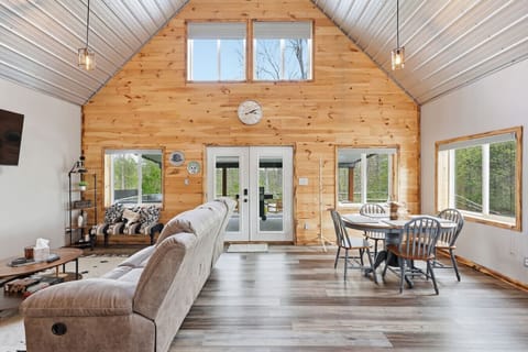 Open floor plan with dining, living, and direct patio access