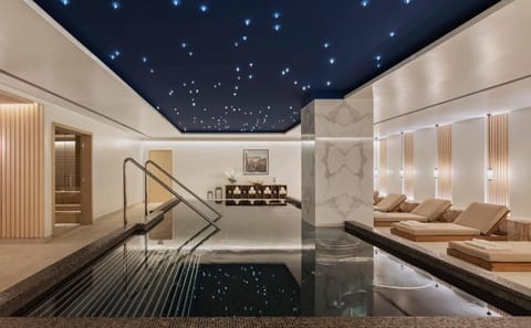 Glide through calm waters under a dreamy starlit ceiling.