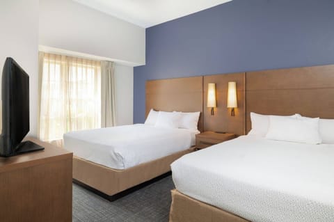Spread out on two plush beds after a full day.
