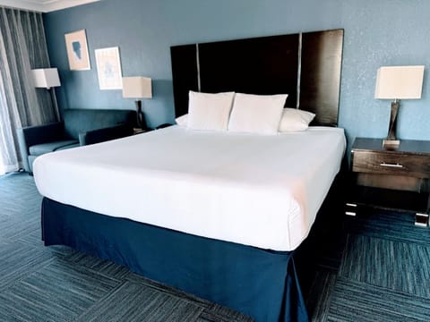 Sink into a king bed in a calm, modern retreat.