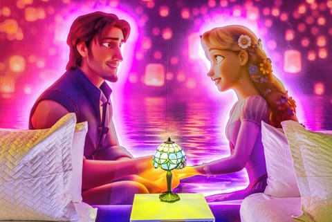Romantic mural of a couple holding hands with a glowing lamp between them.