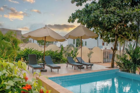 Stretch out on cushioned loungers with sunset breezes nearby.