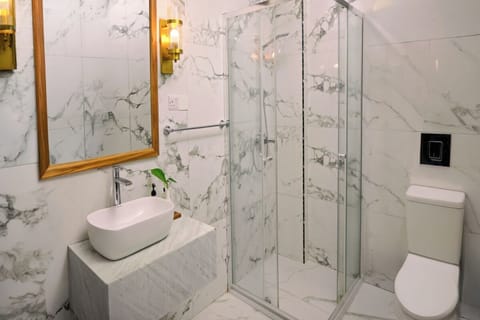 Indulge in a bright marble bathroom for spa-like mornings.
