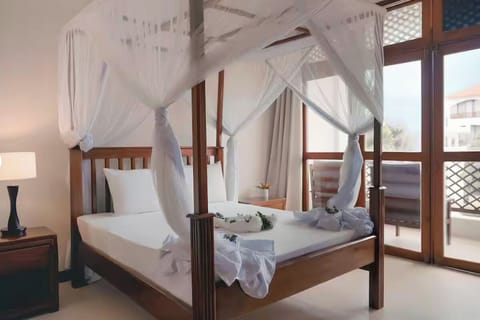 Lounge beneath flowing netting as daylight fills the room.
