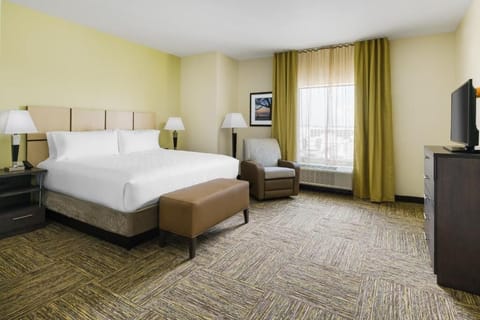 Stretch out and enjoy extra space in this calming king room.