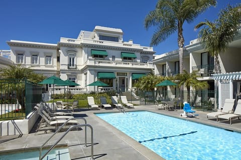 Dive into sunshine and lounge poolside under swaying palms.