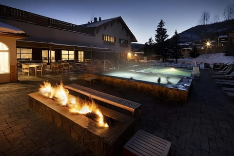 Unwind under the stars with firelight beside steaming waters