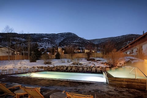 Gaze at starry mountain skies from the steaming poolside.
