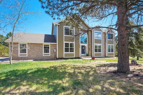 Welcome to Ridgemont Hall ! Tucked into a quiet half-acre lot in the heart of Monument, CO this expansive five-bedroom home makes an unforgettable first impression, where towering pines, Colorado blue skies, and oversized windows set the stage for 