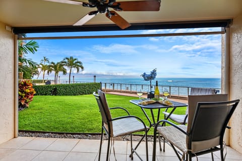 Oceanfront lanai with breathtaking views and outdoor dining