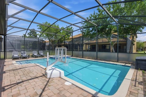 Screened-in pool area w/ loungers & sunny space for relaxing swims all day long