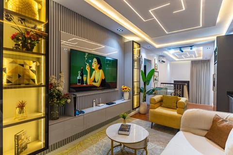 Luxury short-term rental with a welcoming living room and TV for your comfort and convenience.