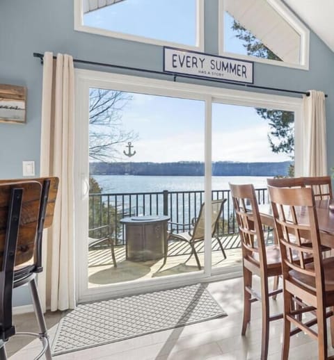 Step through the front door and be immediately welcomed by breathtaking lakefront views.