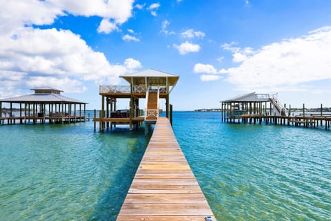 Escape to your own slice of paradise with a spacious pier, shaded pavilions, and direct water access.