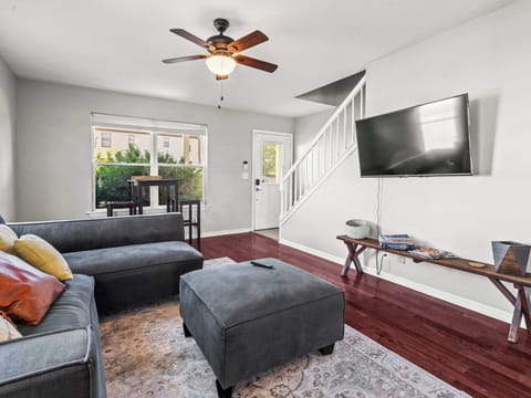 Living Room: Bright and inviting living room with cozy seating, warm natural light, and a relaxing space perfect for movie nights or unwinding after a day of exploring.