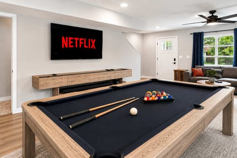 Living Area: Enjoy the ultimate hangout spot with a cozy living room and billiards table, ideal for friendly competition and memorable evenings.