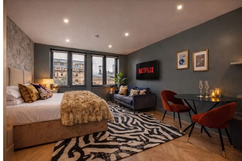 Relax with Netflix, Disney+, and streaming apps on the large Smart TV — ultrafast WiFi included for work or entertainment