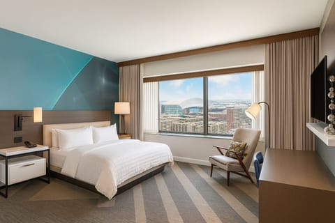 Wake up to skyline views from crisp, cloud-soft bedding.
