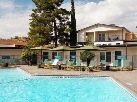 Soak up resort vibes in a sparkling, lounge-lined pool.