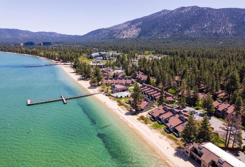 Aerial view of resort showing private beach and dock