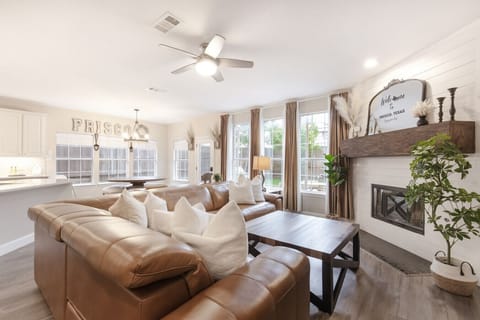 Bright Frisco living room with cozy seating, fireplace, and plenty of space to gather.