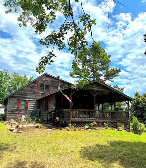 Charming private cabin with a spacious covered porch and peaceful views.