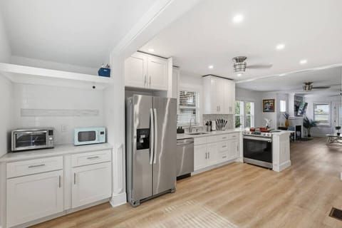 Kitchen: A sophisticated, unified space that serves as the stylish heart of the home.