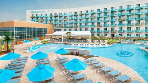 Arrive to a vibrant resort setting with balconies and pool views.
