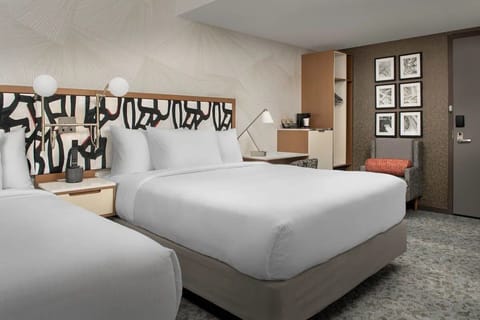Settle in for a restful night with plush pillows and warm lighting.