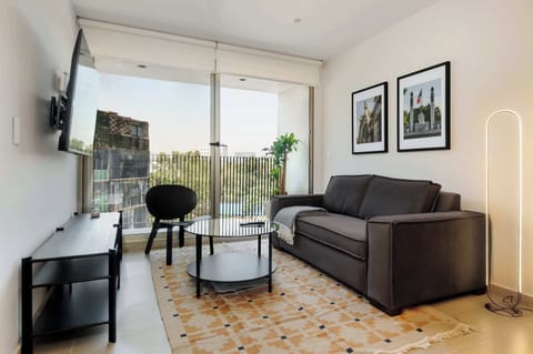 Bright living room with sofa and natural light
